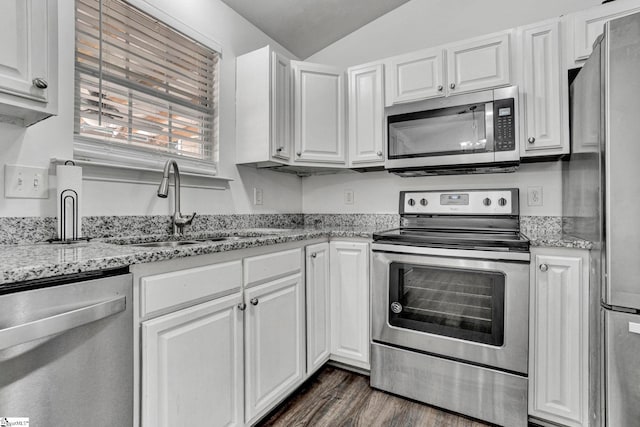232 Ashley Danielle Dr, Duncan, SC 29334 - kitchen featuring a sink, stainless steel appliances, white cabinetry, and lofted ceiling
