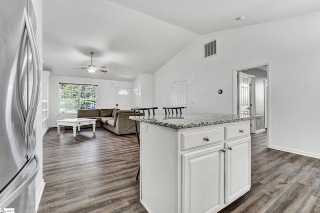 232 Ashley Danielle Dr, Duncan, SC 29334 - kitchen with ceiling fan, dark wood-style flooring, a center island, vaulted ceiling, and freestanding refrigerator