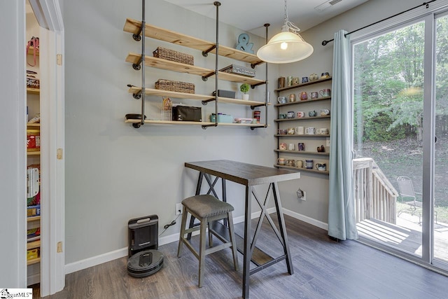 office space with dark wood-type flooring and baseboards