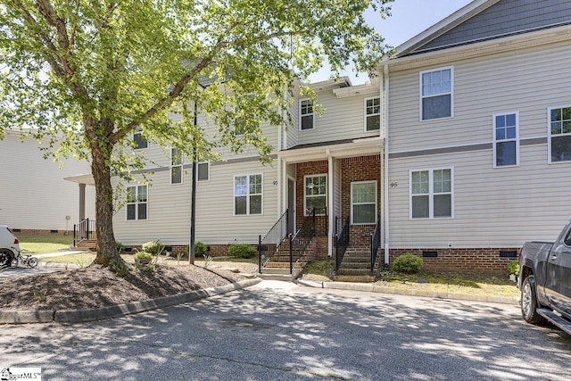 view of front of home featuring crawl space