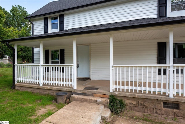 6 Liberty St, Piedmont, SC 29673 - doorway to property featuring a shingled roof and a porch