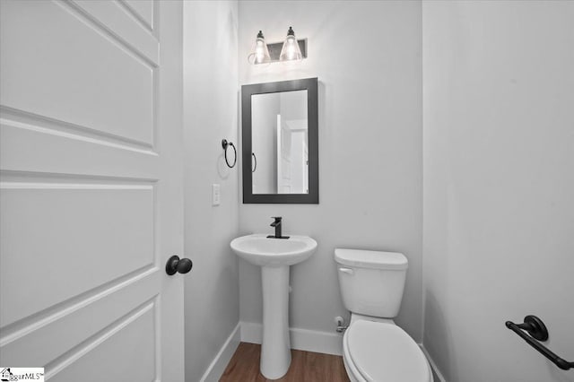 13 Lyman Lake Rd, Lyman, SC 29365 - half bath featuring toilet, baseboards, and wood finished floors