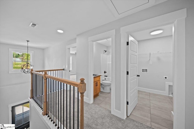 13 Lyman Lake Rd, Lyman, SC 29365 - corridor with visible vents, light tile patterned flooring, light carpet, baseboards, and an upstairs landing