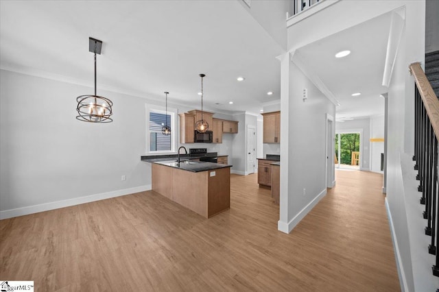 13 Lyman Lake Rd, Lyman, SC 29365 - kitchen featuring brown cabinets, dark countertops, black microwave, a peninsula, and baseboards