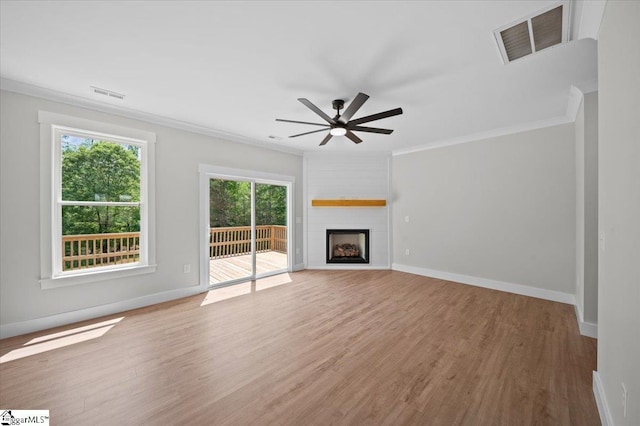13 Lyman Lake Rd, Lyman, SC 29365 - unfurnished living room featuring visible vents, ornamental molding, and light wood-style floors