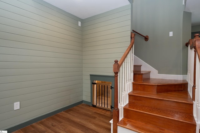 staircase featuring wood finished floors