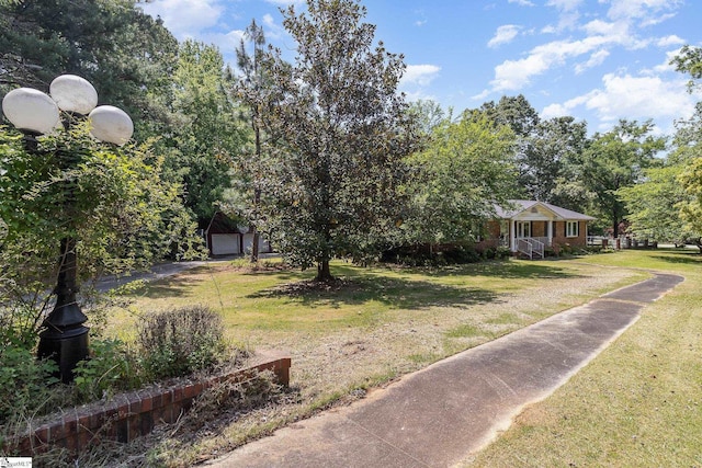view of yard with a detached garage