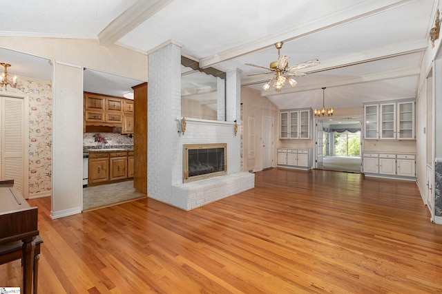 unfurnished living room with a sink, light wood finished floors, a brick fireplace, ceiling fan with notable chandelier, and vaulted ceiling with beams