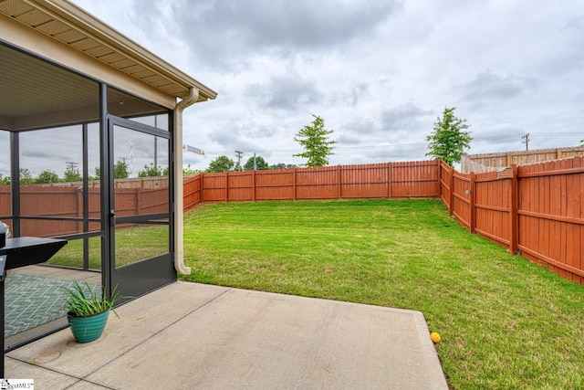 view of yard with a patio and a fenced backyard