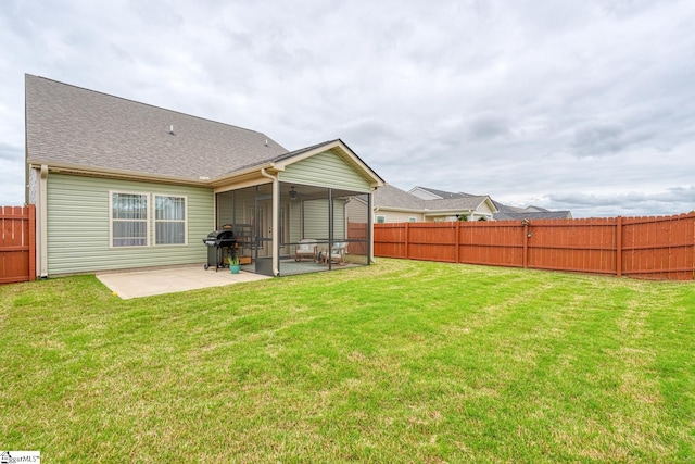 rear view of property with a patio, a fenced backyard, a yard, and a shingled roof