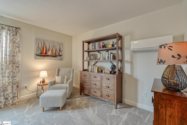 living area with carpet flooring, a textured ceiling, and a wall mounted AC