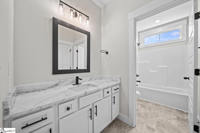 full bath with toilet, baseboards, bathtub / shower combination, and vanity