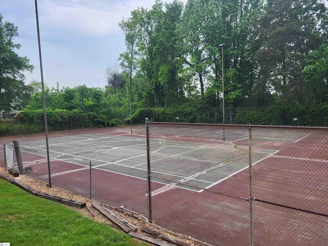 view of sport court with community basketball court and fence