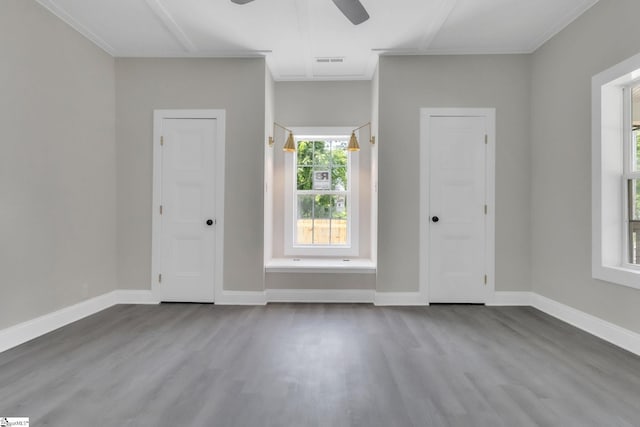 foyer entrance with baseboards, ceiling fan, dark wood-style floors, and visible vents