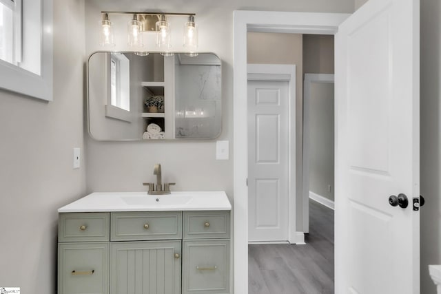 bathroom featuring vanity and wood finished floors