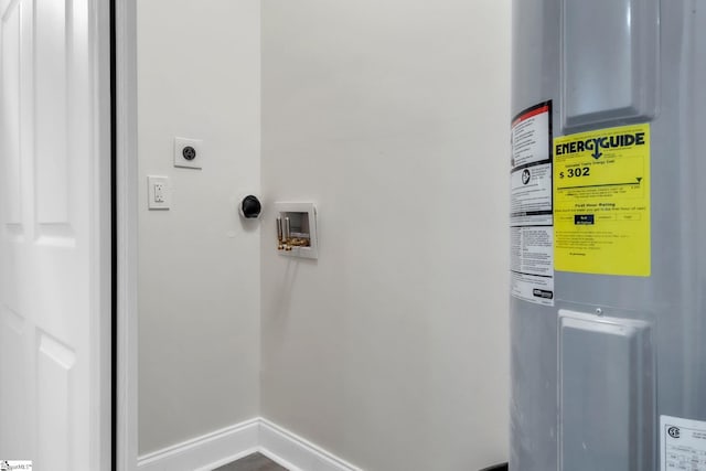laundry area with laundry area, electric dryer hookup, baseboards, hookup for a washing machine, and electric water heater