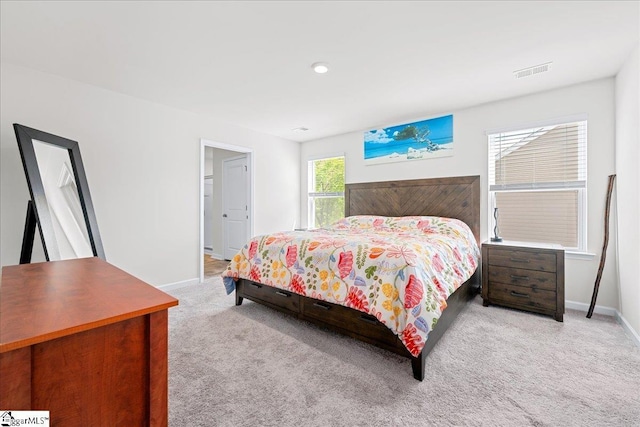 bedroom with visible vents, baseboards, and carpet floors