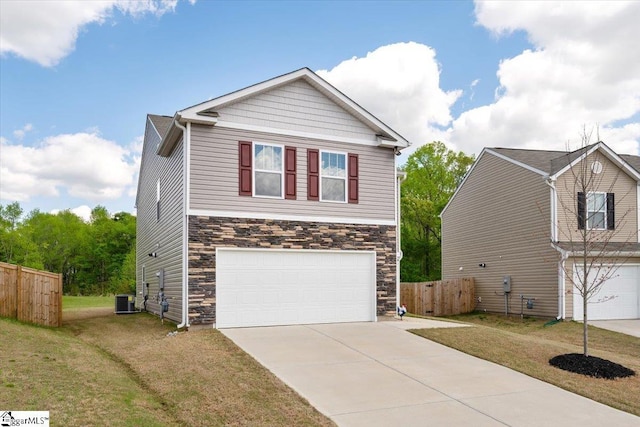 view of front facade with a garage, central AC, fence, stone siding, and driveway