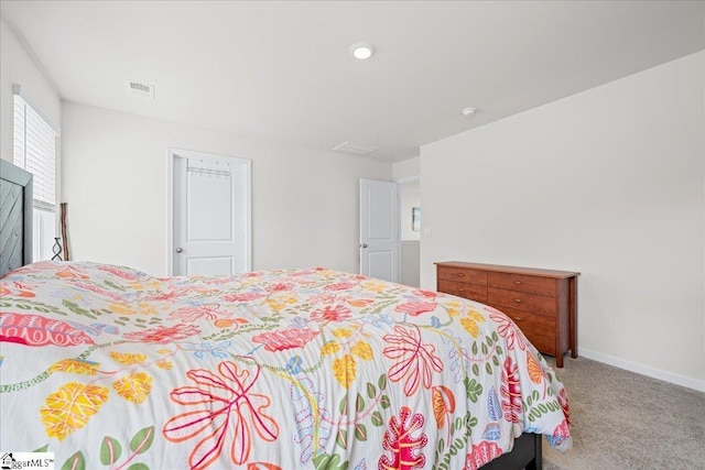bedroom with visible vents, carpet, and baseboards