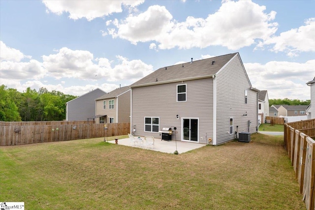 back of house featuring a lawn, a patio, cooling unit, and a fenced backyard