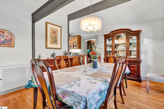 105 Seabright Cir, Cross Hill, SC 39332 - dining room featuring an inviting chandelier and light wood-style flooring