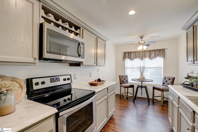 4 Creekbend Ct, Simpsonville, SC 29681 - kitchen with ceiling fan, dark wood-style flooring, visible vents, appliances with stainless steel finishes, and light countertops