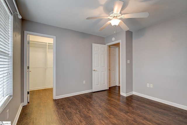 4 Creekbend Ct, Simpsonville, SC 29681 - unfurnished bedroom featuring a walk in closet, baseboards, a closet, and dark wood finished floors