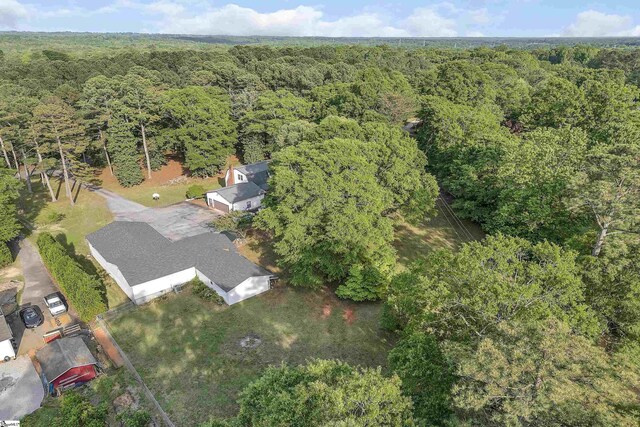 bird's eye view featuring a forest view