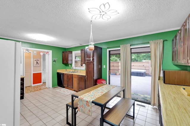dining room with a textured ceiling and ornamental molding