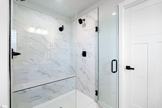 full bath with a shower stall