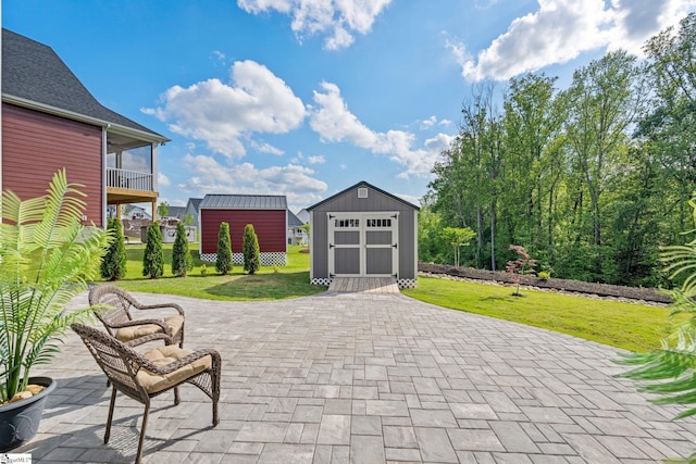 view of patio featuring an outbuilding and a shed