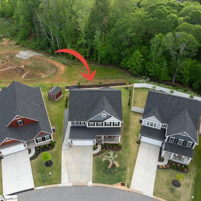 aerial view featuring a view of trees