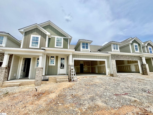 61 Hensley Rd Unit 64, Greenville, SC 29607 - craftsman house featuring board and batten siding, driveway, covered porch, and a garage