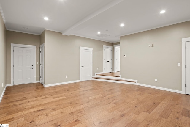 interior space featuring crown molding, recessed lighting, light wood-style floors, and baseboards