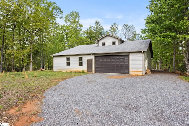 view of front of property featuring an attached garage and driveway