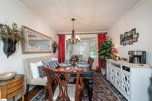 dining area featuring an inviting chandelier, ornamental molding, and dark wood-style flooring