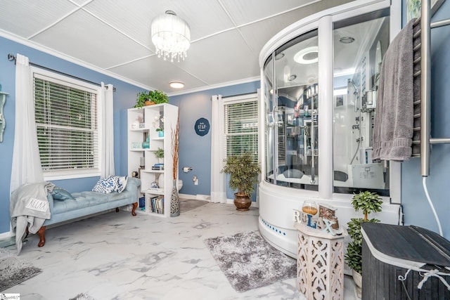interior space with crown molding, plenty of natural light, toilet, and a chandelier