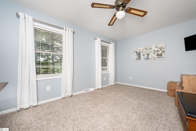 sitting room with visible vents, carpet, ceiling fan, and baseboards