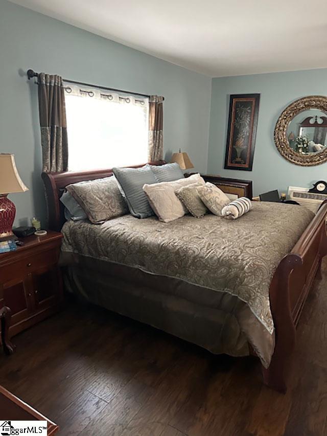 bedroom featuring wood finished floors