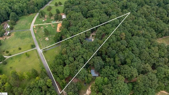 bird's eye view featuring a view of trees