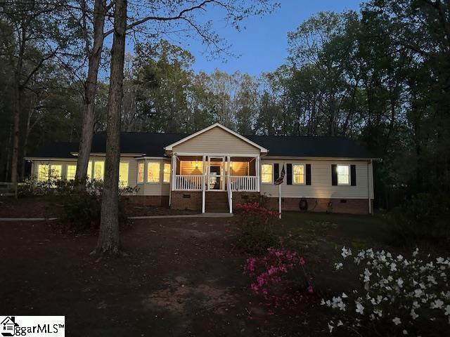 rear view of property featuring crawl space
