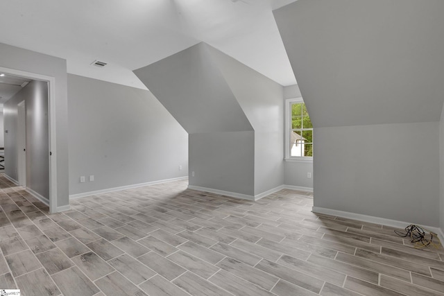 205 Rosebank Way, Greenville, SC 29615 - bonus room featuring baseboards, visible vents, wood finished floors, and lofted ceiling