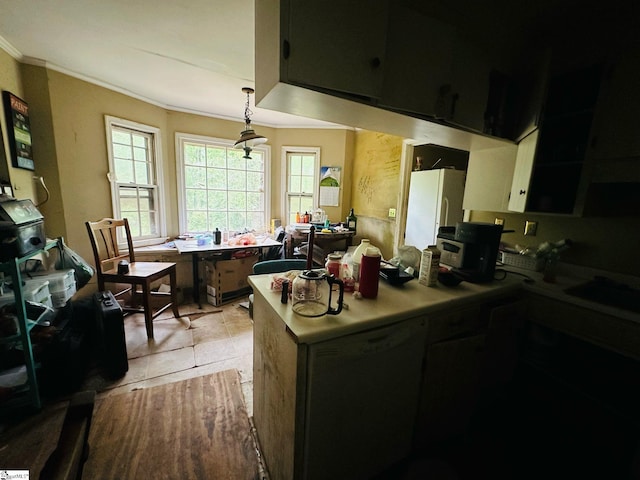 903 Calvert Ave, Clinton, SC 29325 - kitchen featuring crown molding, light countertops, freestanding refrigerator, decorative light fixtures, and light tile patterned floors