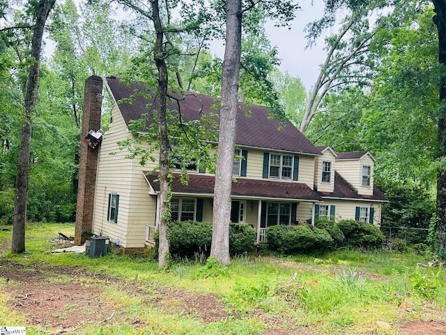 903 Calvert Ave, Clinton, SC 29325 - view of front of house featuring a shingled roof, a chimney, cooling unit, and a porch