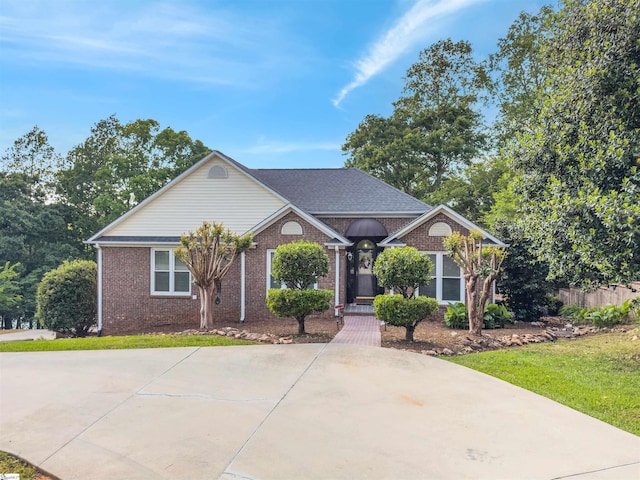 view of front of house featuring brick siding