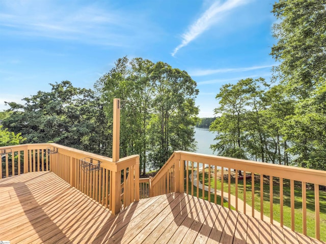 wooden terrace featuring a water view
