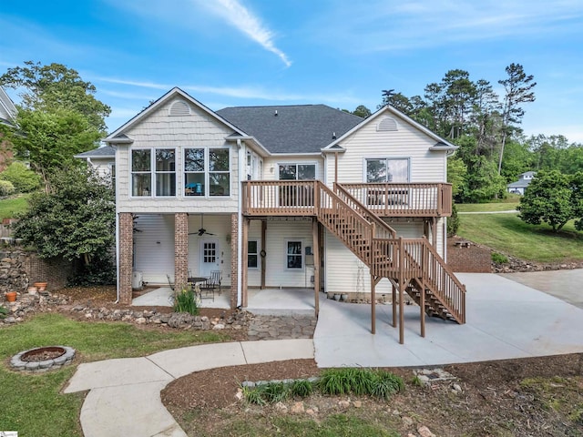 back of property with stairway, a patio, a ceiling fan, and a wooden deck