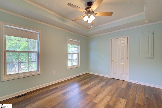 602 Habersham Ln, Easley, SC 29642 - spare room with visible vents, ornamental molding, ceiling fan, a raised ceiling, and dark wood finished floors