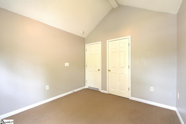 602 Habersham Ln, Easley, SC 29642 - unfurnished bedroom featuring baseboards, high vaulted ceiling, dark carpet, and beam ceiling