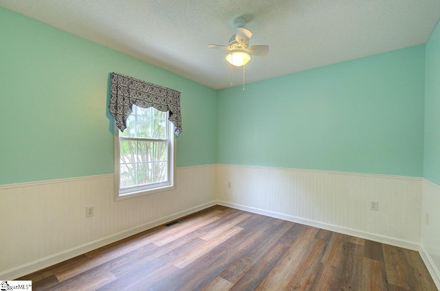 602 Habersham Ln, Easley, SC 29642 - empty room featuring a ceiling fan, wainscoting, and wood finished floors